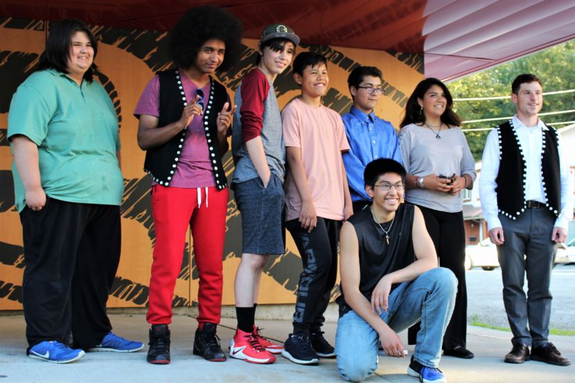 (From left to right) Teenagers Arturo Rodriguez, AJ Hoyle, Keegan Kanan, Bradley Dybdahl, Jacob Brouillette, Marcel Cohen and Kenndra Willard pose with Will Kronick from the Central Council of Tlingit and Haida on July 30, 2018. (Phot by Adelyn Baxter/KTOO)