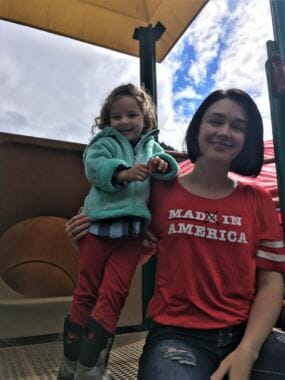 Jessica Rider poses with her daughter Camilla after the Families Belong Together Rally on June 30, 2018. (Photo by Adelyn Baxter/KTOO)