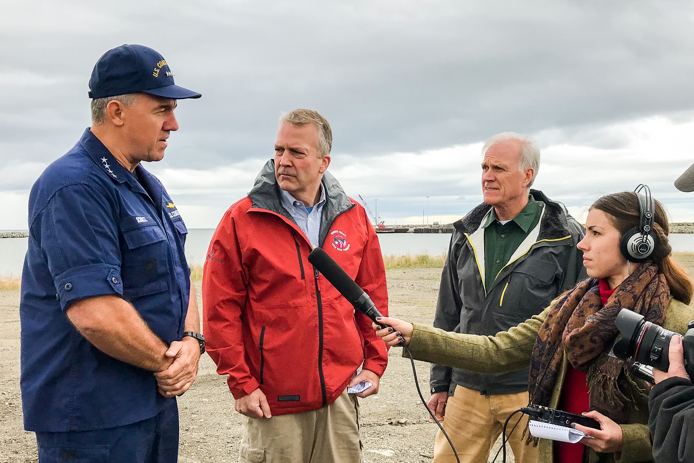 U.S. Coast Guard Commandant Karl Schultz, U.S. Sen. Dan Sullivan, and Secretary of the Navy Richard Spencer talked to reporters from the beach near the Nome Port. Photos by Margaret DeMaioribus/KNOM.