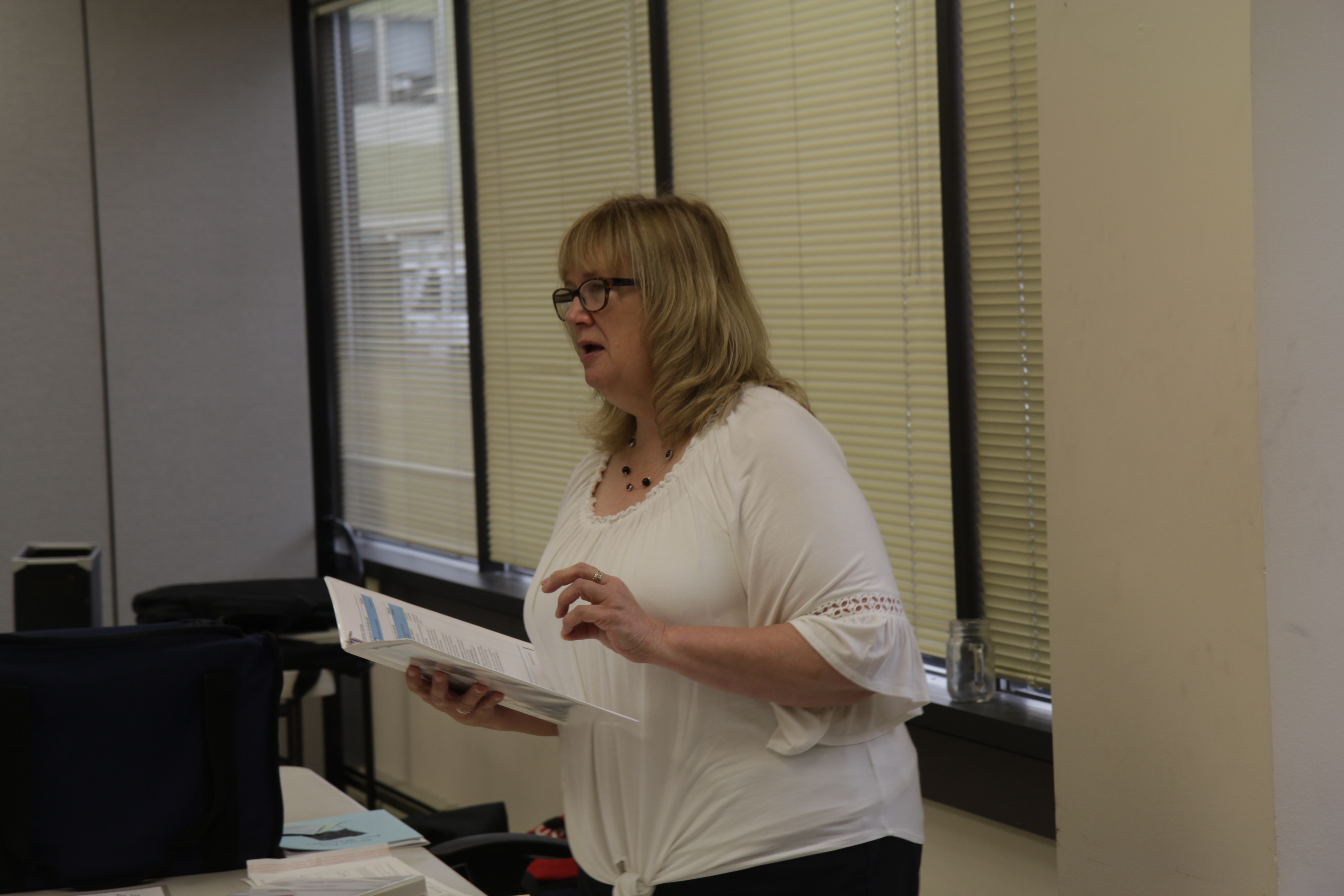 Julie Husmann with the Division of Elections teaches volunteer poll workers at a three-hour training in Anchorage. (Photo by Wesley Early/Alaska Public Media)