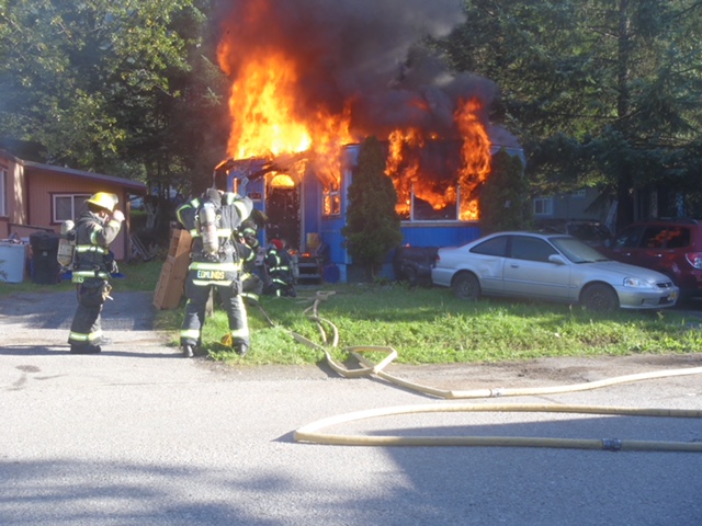 A Capital City Fire/Rescue crew works the scene of a mobile home fire Saturday, Aug. 11, 2018, in Switzer Village. (Photo courtesy Juneau Police Department)