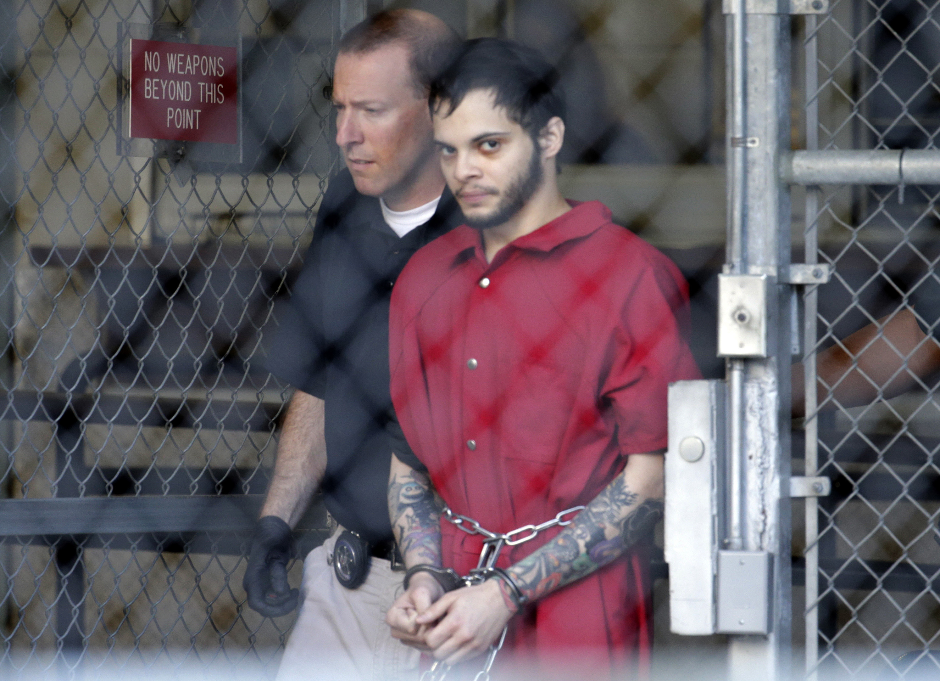 Esteban Santiago leaves the Broward County jail for a hearing in federal court on Jan. 17, 2017, in Fort Lauderdale, Fla. Santiago has been sentenced to life in prison for a Jan. 6 shooting rampage at a Fort Lauderdale-Hollywood International Airport baggage claim area. (Photo by Lynne Sladky/Associated Press)