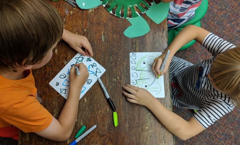 Children draw at the Kindergarten Boot Camp at Harborview Elementary School in summer 2018. It was the first year the Juneau School District put together the school-readiness camp.