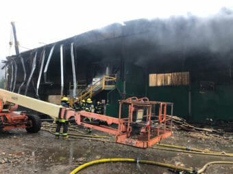 Capital City Fire/Rescue personnel fight a fire early Thursday at the former recycling center at the Juneau landfill. (Photo courtesy Fire Marshal Daniel Jager)