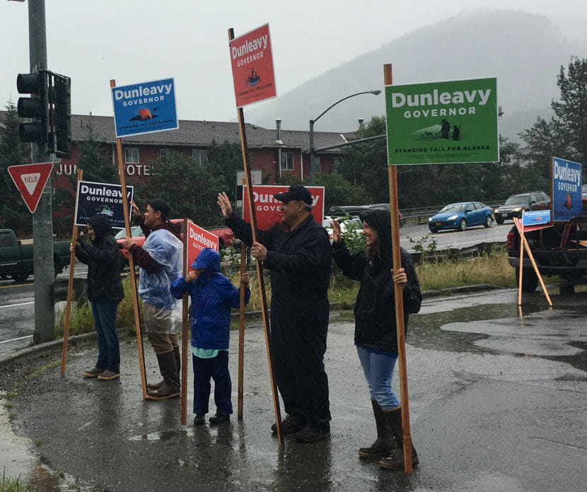 Supporters of Mike Dunleavy's campaign for governor wave campaign signs on the Aug. 21 primary in Juneau. The group Dunleavy for Alaska, the American Civil Liberties Union of Alaska and Eric Seibles sued over state enforcement of a ban on outdoor advertising in July. A judge issued a temporary restraining order on Monday allowing some political signs. (Photo by Andrew Kitchenman/KTOO)