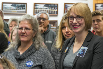 Juneau Assembly candidates Michelle Bonnet Hale, left, and Carole Triem watch election returns on Tuesday, Oct. 2, 2018, at City Hall. (Photo by Mikko Wilson/KTOO)