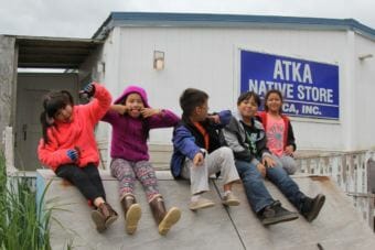 Kids play outside Atka's general store.