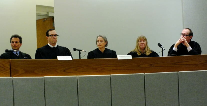 Superior Court Judge Amy Gurton Mead (center) listens to other judges during her installation and robing ceremony Oct. 26, 2018 at the Dimond Courthouse. Sitting from far left, Senior Judge Keith Levy, Ketchikan District Court Judge Kevin Miller, Juneau District Court Judge Kirsten Swanson, and Sitka Superior Court Judge Jude Pate.