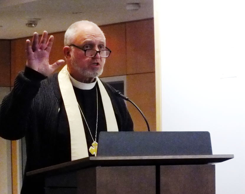 Father Gordon Blue of the Holy Trinity Episcopal Church delivers a benediction at Father Andrew P. Kashevaroff State Library, Archives and Museum.