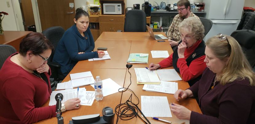 Alaska election officials hold a press conference over teleconference from the division's office in downtown Juneau on Nov. 26, 2018. Clockwise from bottom left: Elections Director Josie Bahnke, Elections Communication Manager Samantha Miller, Anchorage Daily News reporter James Brooks, State Review Board member Stuart Sliter, and State Review Board member Lynda Thater-Flemmer.