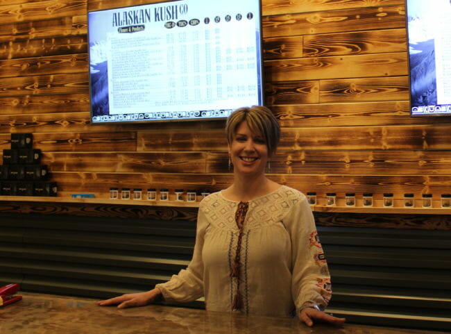 Alaskan Kush Company manager Amy Herrick inside the retail portion of the store. The business also hopes to open a cafe area if and when on-site consumption is approved. (Photo by Adelyn Baxter/KTOO)