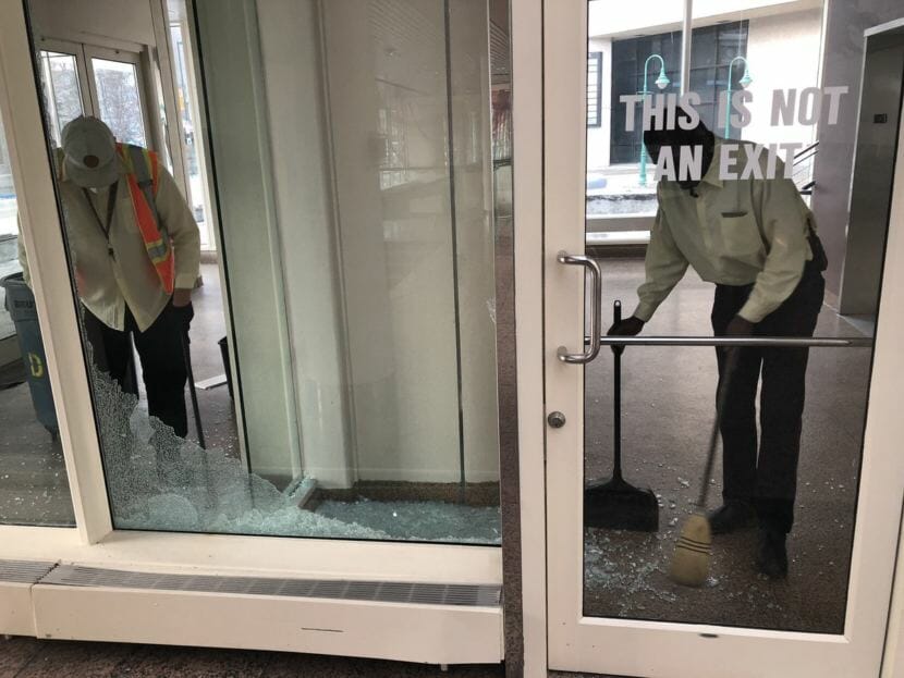 A broken window gets swept up after the Nov. 30, 2018, earthquake in Anchorage.