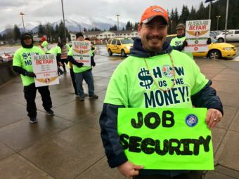John Walters rallies Alaska Airlines workers at Juneau International Airport on Dec. 8, 2018.