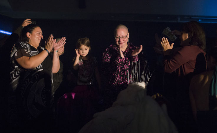 Mary Folletti and her family cheer on Juneau artist Ricky Tagaban during his performance at the”Besties for Breasties” drag show medical fundraiser on September 21, 2018.