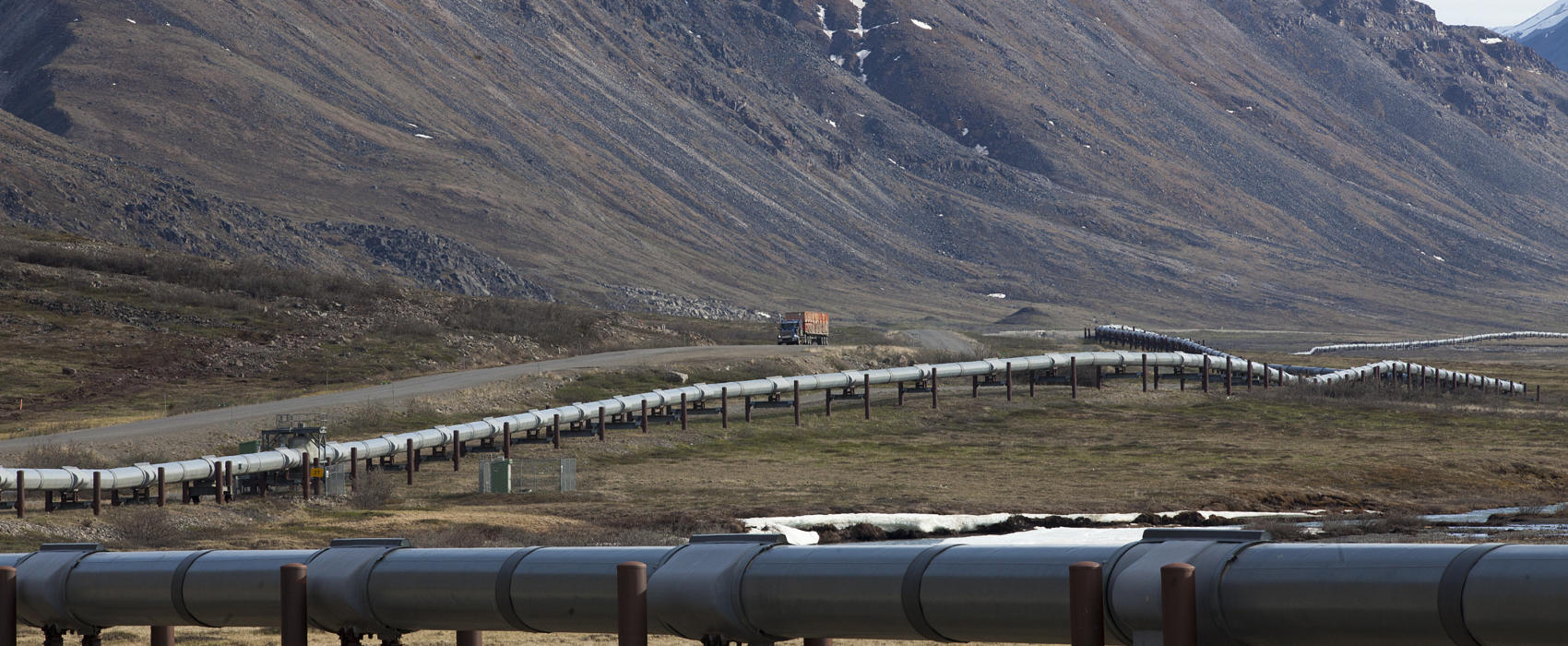 A truck drives up the Dalton Highway near the Toolik Field Station on June 9, 2017, in the North Slope Borough. (Photo by Rashah McChesney/Alaska's Energy Desk)