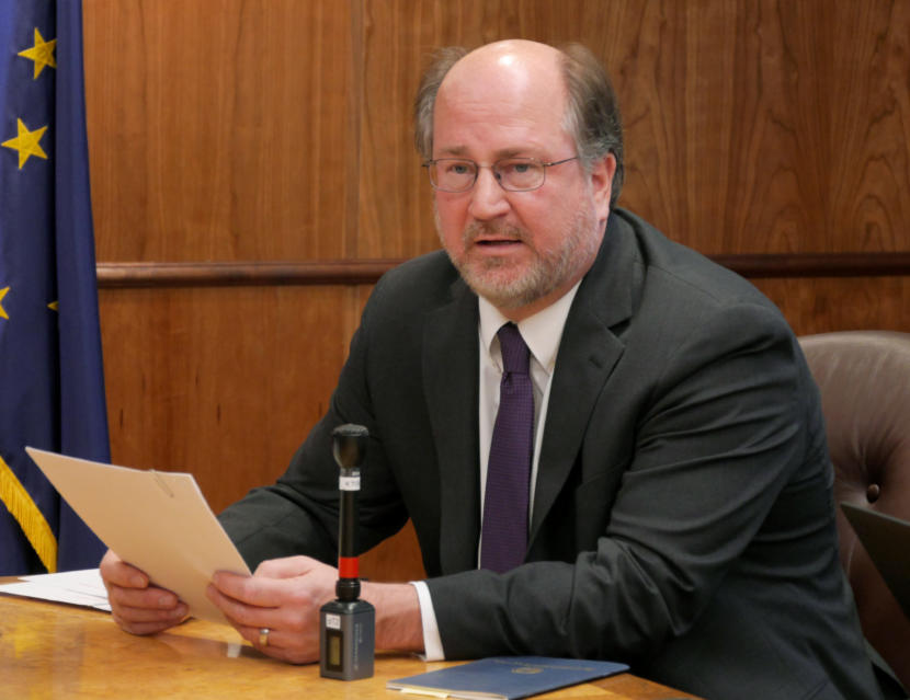 Attorney General Kevin Clarkson reads summaries of three constitutional amendments proposed by Gov. Mike Dunleavy to reporters at a press conference in the Capitol in Juneau on Jan. 30, 2019.