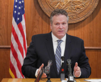 Gov. Mike Dunleavy discusses his proposed budget- and Alaska Permanent Fund dividend-related constitutional amendments with reporters at a press conference in the Capitol in Juneau on Jan. 30, 2018.