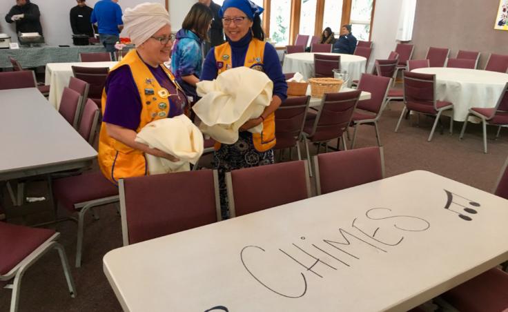 Mukhya Khalsa (left) and Navtej Garcia, members of the Mendenhall Flying Lions Club, helped clean up the breakfast fundraiser for furloughed federal workers in Juneau on Jan. 19, 2019. Khalsa said, "We try to find tasks in the community where we can actually volunteer rather than just give money." (Photo by Zoe Grueskin/KTOO)