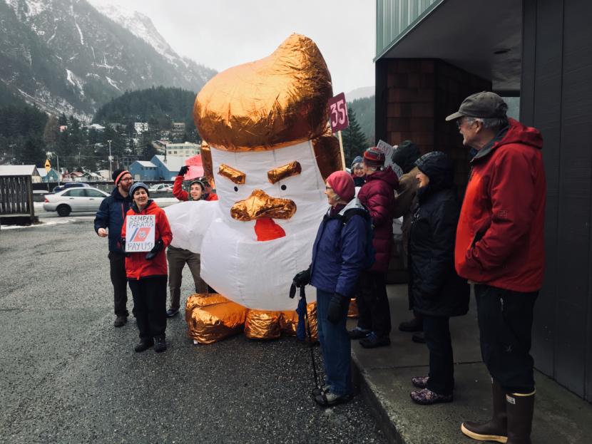 Protesters calling for an end to the partial government shutdown chanted outside the Juneau offices of Alaska’s U.S. senators on Jan. 24, 2019.