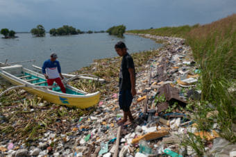 This line of garbage extends all the way around the shore of the Navotas neighborhood in Manila.