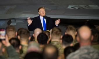 President Donald Trump speaks to more than 100 Airmen, Sailors, Soldiers, Marines and Coast Guardsmen at Joint Base Elmendorf-Richardson, Alaska, Feb. 28, 2019. The president was at the base to meet with service members after returning from a summit in Hanoi, Vietnam. His plane refueled before continuing to Joint Base Andrews, Maryland.