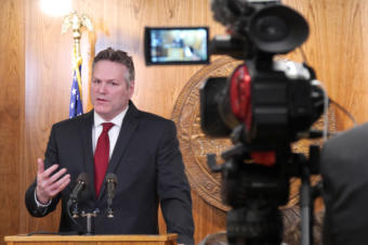 Gov. Michael Dunleavy introduces his amended state budget to reporters at a press availability at the Capitol in Juneau on Feb. 13, 2019.
