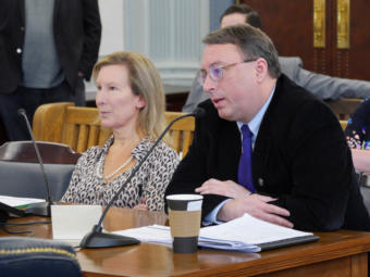 Policy Director Mike Barnhill of the Office of Management and Budget presents information about the state operating budget to the Senate Finance Committee in Juneau on Feb. 18, 2019. OMB Director Donna Arduin accompanied him.
