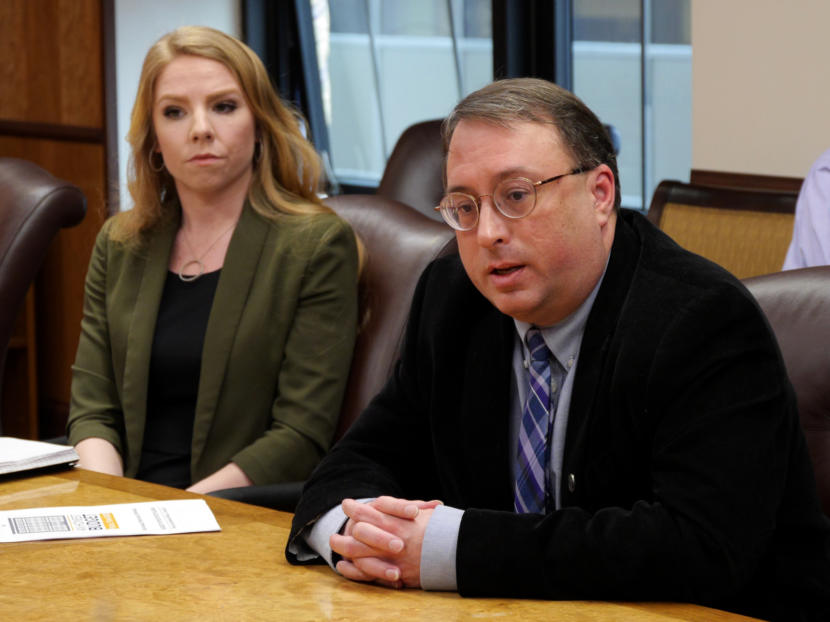 Policy Director Mike Barnhill of the Office of Management and Budget answers a reporter’s question about the most recent version of Gov. Michael Dunleavy’s state operating budget in the governor’s cabinet room in the Capitol in Juneau on Feb. 13, 2019. OMB Deputy Director Laura Cramer, is seated next to him. They were at a budget briefing held for the press.