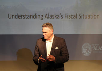 Gov. Mike Dunleavy speaks with a constituent ahead of a presentation at a policy forum organized by Americans for Prosperity’s Alaska chapter, March 26, 2019.