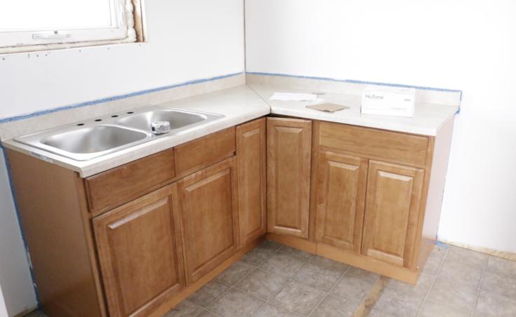 ANTHC installs new kitchen cabinets and sinks in houses to accommodate the new plumbing. Eek, Alaska February 20, 2019.(Photo by Anna Rose MacArthur/KYUK)