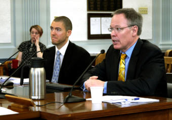 Department of Revenue Commissioner-designee Bruce Tangeman, right, presents the spring revenue forecast to the Senate Finance Committee in Juneau on March 18, 2019. He was accompanied by the department economist Dan Stickel.