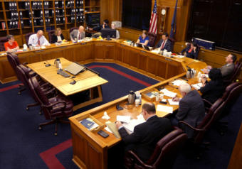 House Finance Committee members listen to people around the state comment on the proposed state budget via teleconference in Juneau on March 25, 2019.