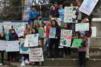 Students made signs with slogans condemning a lack of political action on climate change.