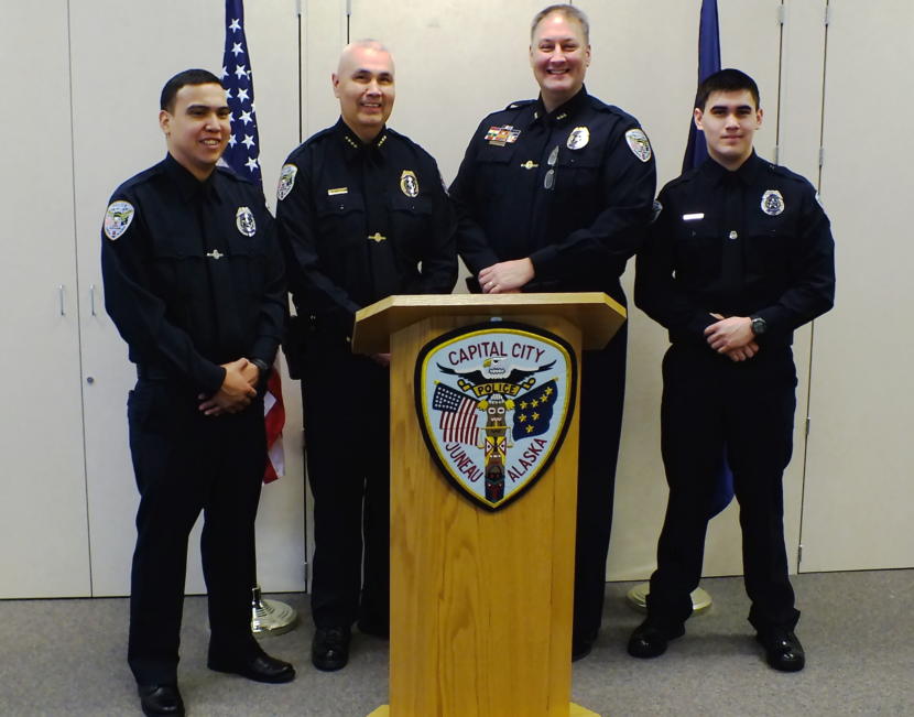From left, new Juneau Police Officer Duain White, Chief Ed Mercer, Deputy Chief Dave Campbell, and new Officer Jonah Hennings-Booth pose for photos after a swearing in ceremony at the Juneau Police Department on Feb. 21, 2019.