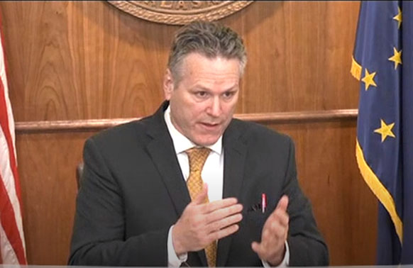 Alaska Gov. Mike Dunleavy speaks at his Tuesday news conference with a red pen in his jacket pocket — a reference to his veto power.