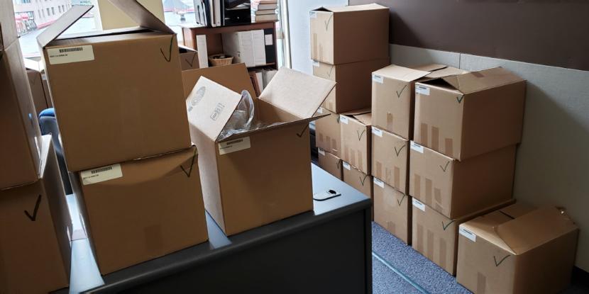 Boxes of resolved cases stack up in Juneau Area Court Administrator Neil Nesheim's office in the Dimond Courthouse in Juneau on April 22, 2019. Normally, resolved cases like these are shipped to Anchorage for centralized scanning, digital archiving and shredding, but Nesheim said that's on standby pending repairs to shelving damaged in 2018's earthquake.