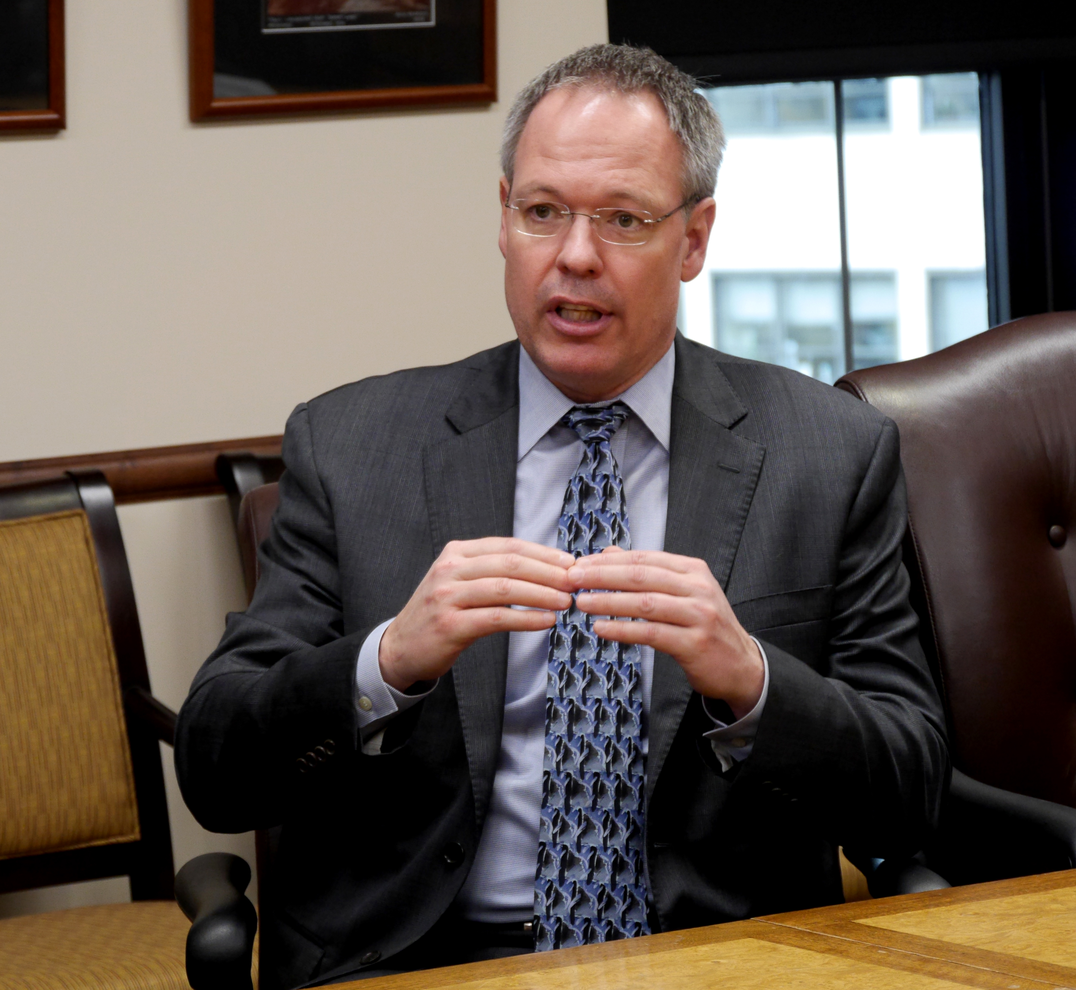 Revenue Commissioner Bruce Tangeman answers questions from the press about the governor’s 10-year budget plan on March 21, 2019. He spoke at a press briefing held in the governor’s cabinet room at the State Capitol in Juneau.