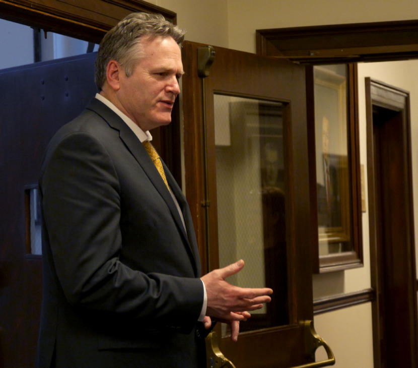 Gov. Mike Dunleavy talks with Sen. Lora Reinbold, R-Anchorage, in the 2nd floor hallway of the Capitol in Juneau on March 7, 2019. He had just left the House Speaker’s office.