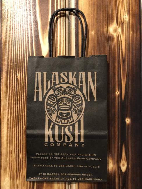 Alaskan Kush Company warns customers about state laws regarding marijuana consumption by printing them on their bags. (Photo courtesy of Amy Herrick)