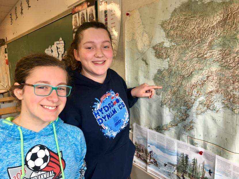 Mackenzie Olver (left) and Sandra Bouvier point out Akiuk on a map of Alaska at Dzantik'i Heeni Middle School on April 17, 2019. (Photo by Zoe Grueskin/KTOO)