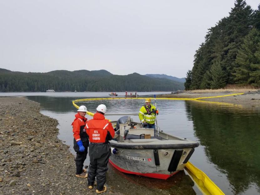 U.S. Coast Guard and Hecla Greens Creek Mine crews deploy a boom April 3, 2019 to contain a fictitious heavy fuel oil spill at Hawk Inlet. (Photo courtesy of Coast Guard Sector Juneau)