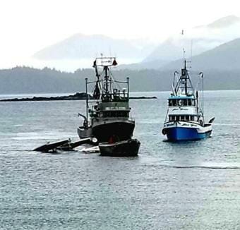 A Taquan Beaver is towed to shore after crashing into the water near Metlakatla, May 20, 2019. Both people on board were killed.
