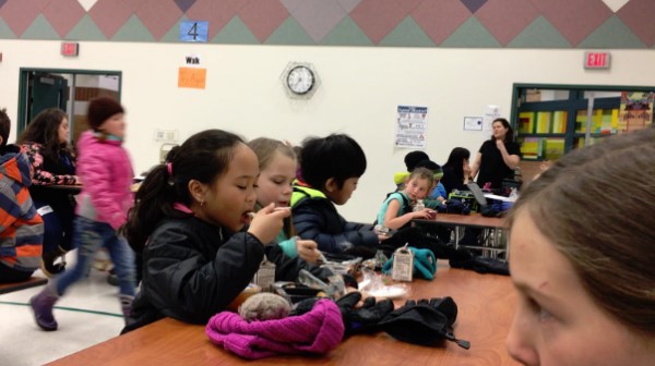 Anchorage students eating during a “silent lunch.” (Screen grab of a Health, Wellness, Nutrition, and Student Learning Ad Hoc committee presentation via Kelly Lessens)