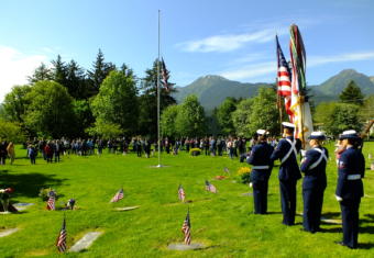 U.S. Coast Guard color guard prepares stands ready before the Memorial Day service at Evergreen Cemetery on May 27, 2019.