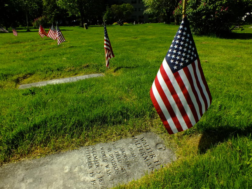 U.S. flags were placed at the gravestones of veterans for the Memorial Day service at Evergreen Cemetery on May 27, 2019.
