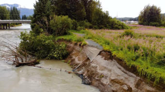 A trail runs off the edge of the eroded bank of the Mendenhall River near Brotherhood Bridge on August 10, 2018.