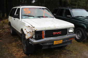 A damaged SUV sits in a lot during a Juneau Police Department auction for unclaimed and forfeited vehicles in November, 2018. (Photo by Zoe Grueskin/KTOO)