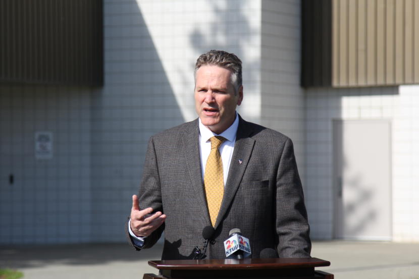 Alaska Gov. Mike Dunleavy speaks at a press conference in front of Wasilla Middle School.
