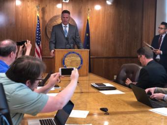 Alaska Gov. Mike Dunleavy speaks to reporters during a press conference at the Capitol, June 28, 2019.