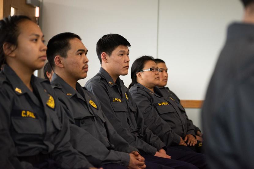 Yukon-Kuskokwim Delta officers wait to receive their graduation certificates from Rural Law Enforcement Training at Yuut Elitnaurviat in Bethel on June 14, 2019.